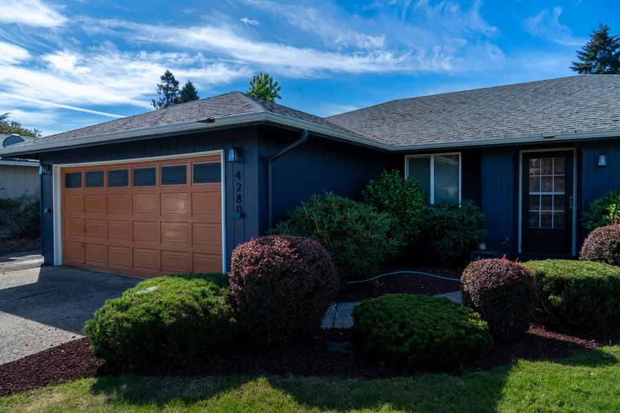 Front elevation and garage door after the exterior repaint