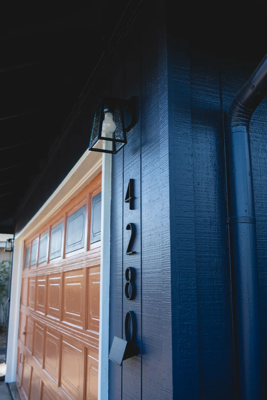 Exterior light fixture and painted siding detail