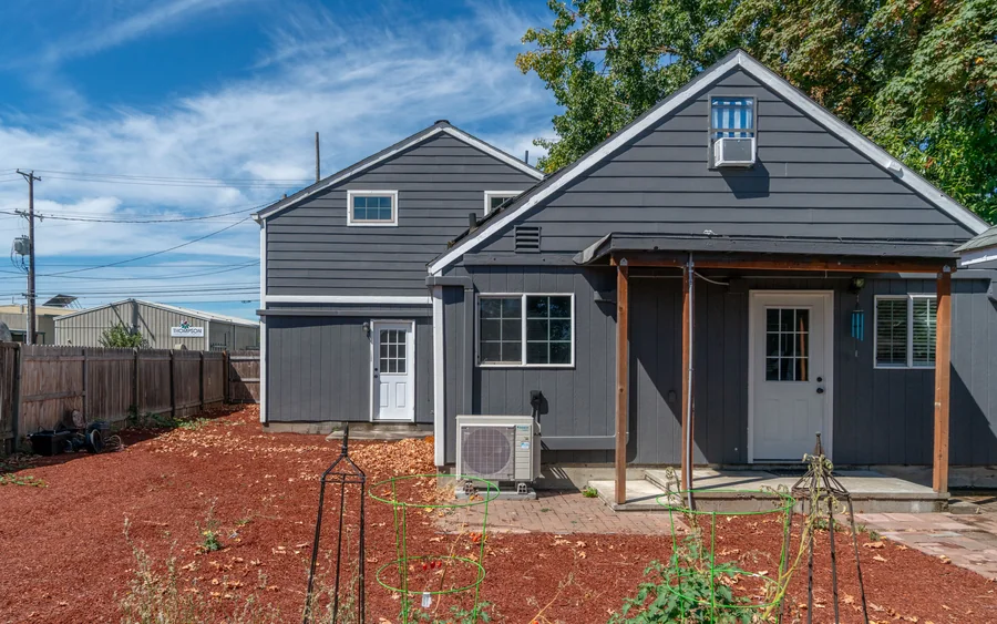 House exterior in dark slate with a covered porch